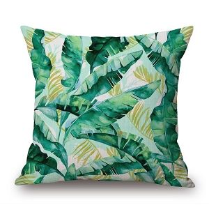 Zielona poduszka dekoracyjna w liście jungle