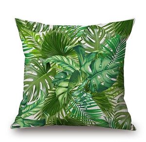 Zielona poduszka dekoracyjna w egzotyczne liście jungle
